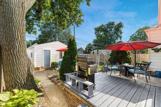 366 E Jeffrey Pl, Columbus, OH 43214 - deck with outdoor dining area, a fenced backyard, a shed, and grilling area