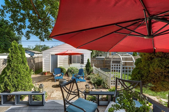366 E Jeffrey Pl, Columbus, OH 43214 - wooden deck featuring an outbuilding and a fenced backyard