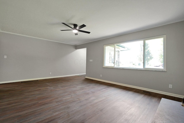1370 Wiltshire Rd, Columbus, OH 43223 - spare room featuring ornamental molding, ceiling fan, and dark wood finished floors