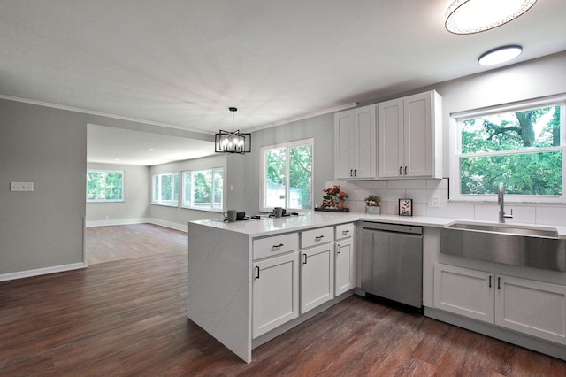 1370 Wiltshire Rd, Columbus, OH 43223 - kitchen featuring stainless steel dishwasher, a peninsula, dark wood-style flooring, open floor plan, and tasteful backsplash