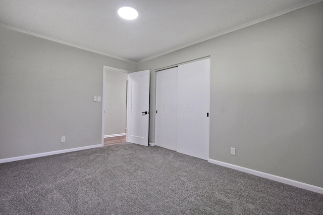 1370 Wiltshire Rd, Columbus, OH 43223 - unfurnished bedroom featuring crown molding, carpet floors, and a closet