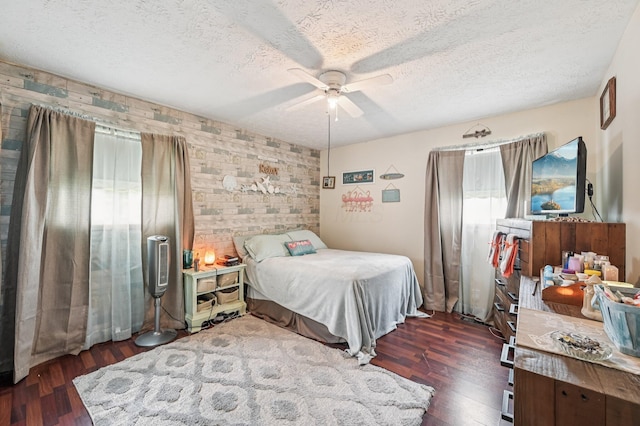 932 Brian Dr, Reynoldsburg, OH 43068 - bedroom with dark wood-type flooring, a textured ceiling, and a ceiling fan