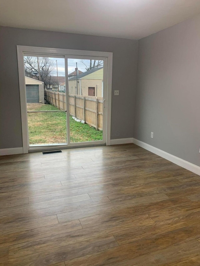 436 S Wayne Ave, Columbus, OH 43204 - unfurnished room with baseboards and wood finished floors