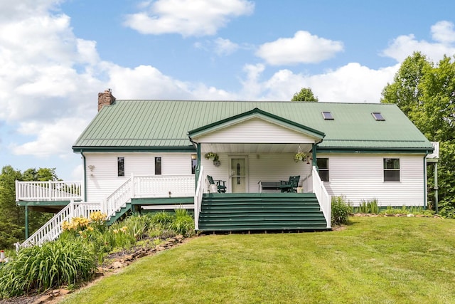 51801 State Route 671, Londonderry, OH 45647 - back of property with stairway, a chimney, a lawn, and a metal roof