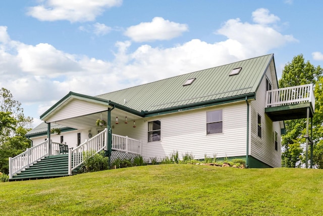 51801 State Route 671, Londonderry, OH 45647 - back of house featuring a lawn, stairway, and a porch