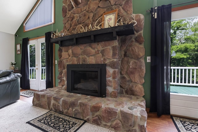 51801 State Route 671, Londonderry, OH 45647 - living area with lofted ceiling, plenty of natural light, wood finished floors, and a fireplace