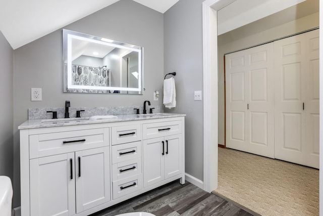 51801 State Route 671, Londonderry, OH 45647 - full bath with double vanity and wood finished floors