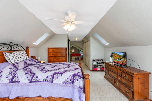 51801 State Route 671, Londonderry, OH 45647 - bedroom featuring a skylight, light colored carpet, vaulted ceiling, and ceiling fan