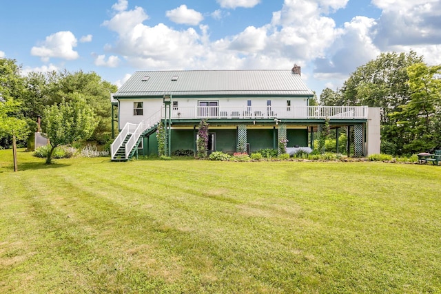 51801 State Route 671, Londonderry, OH 45647 - rear view of house featuring a wooden deck, a chimney, stairs, and a lawn