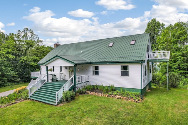 51801 State Route 671, Londonderry, OH 45647 - view of front of home featuring covered porch, a front yard, and a chimney