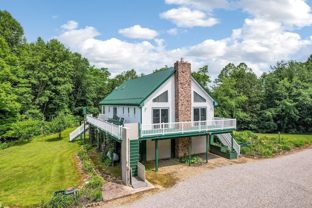 51801 State Route 671, Londonderry, OH 45647 - view of front of home with stairway, driveway, a wooden deck, a front yard, and a chimney
