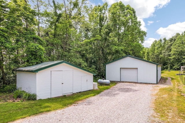 51801 State Route 671, Londonderry, OH 45647 - detached garage with gravel driveway