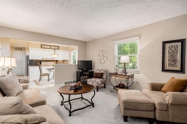 7771 Strathmoore Rd, Dublin, OH 43016 - living area with a textured ceiling