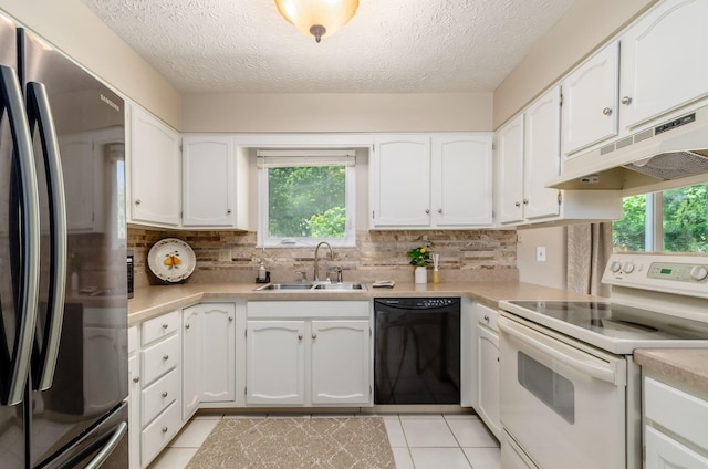 7771 Strathmoore Rd, Dublin, OH 43016 - kitchen with freestanding refrigerator, dishwasher, white electric stove, under cabinet range hood, and light countertops