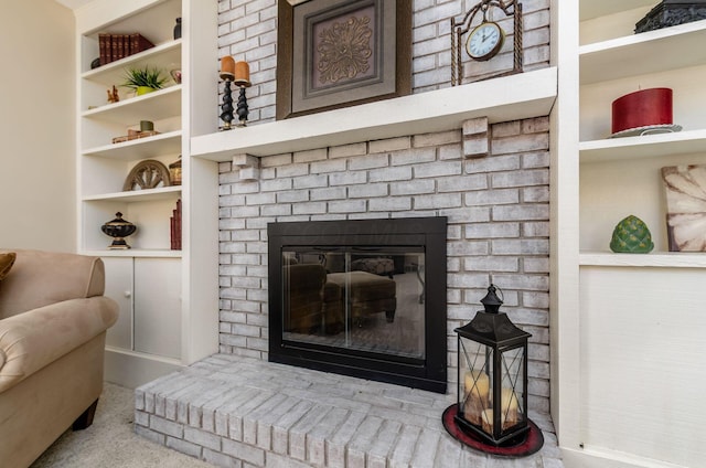 7771 Strathmoore Rd, Dublin, OH 43016 - detailed view of a fireplace, carpet, and built in features