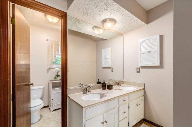 7771 Strathmoore Rd, Dublin, OH 43016 - full bathroom with double vanity and a textured ceiling