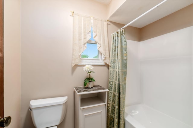 7771 Strathmoore Rd, Dublin, OH 43016 - bathroom with toilet and shower / tub combo with curtain
