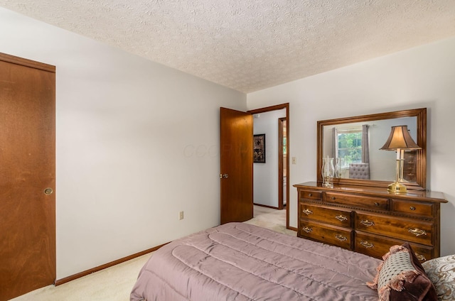 7771 Strathmoore Rd, Dublin, OH 43016 - carpeted bedroom featuring a textured ceiling