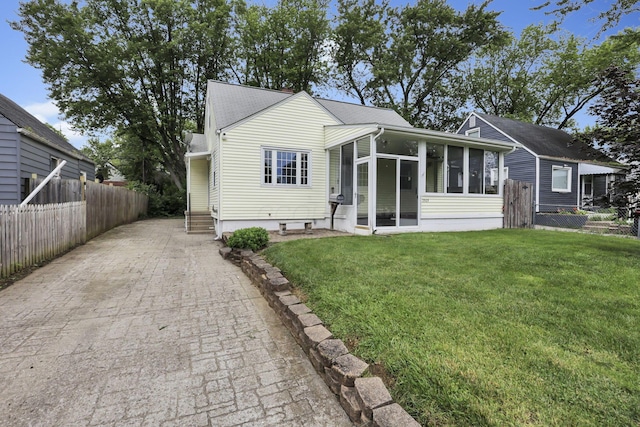 3505 Dresden St, Columbus, OH 43224 - view of front of property featuring a sunroom and driveway