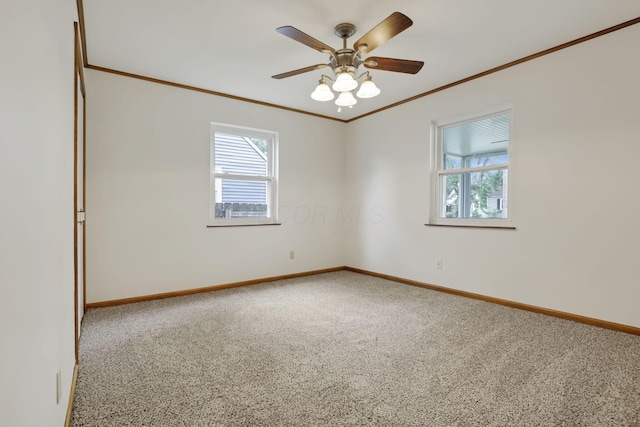 3505 Dresden St, Columbus, OH 43224 - carpeted spare room featuring healthy amount of natural light, crown molding, and a ceiling fan