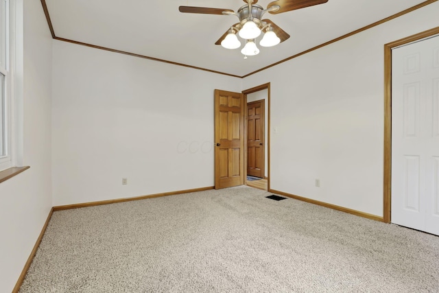 3505 Dresden St, Columbus, OH 43224 - unfurnished room with crown molding, carpet flooring, and ceiling fan