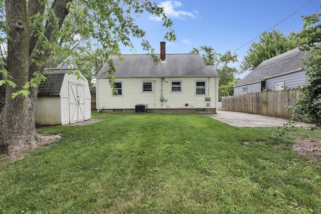 3505 Dresden St, Columbus, OH 43224 - back of property featuring a patio area, a shed, and a chimney