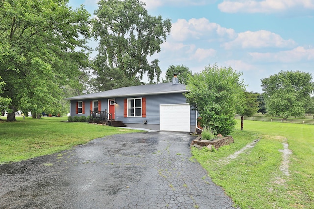 4634 State Route 61, Sunbury, OH 43074 - ranch-style house with an attached garage, driveway, and a chimney
