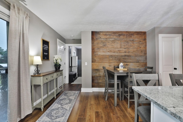 4634 State Route 61, Sunbury, OH 43074 - dining space featuring dark wood-type flooring and wood walls
