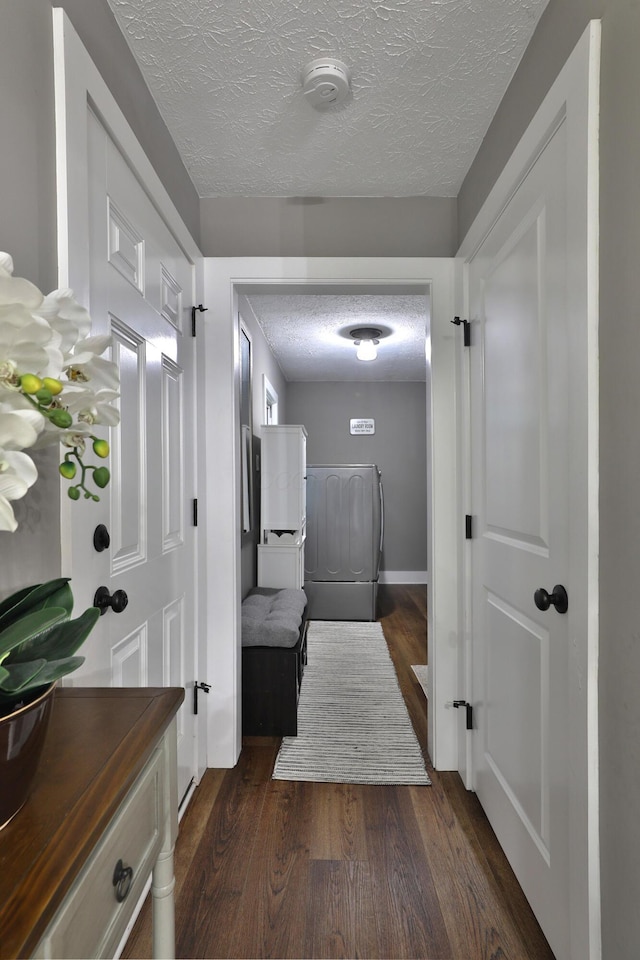 4634 State Route 61, Sunbury, OH 43074 - hall featuring a textured ceiling, dark wood-type flooring, and washer / clothes dryer