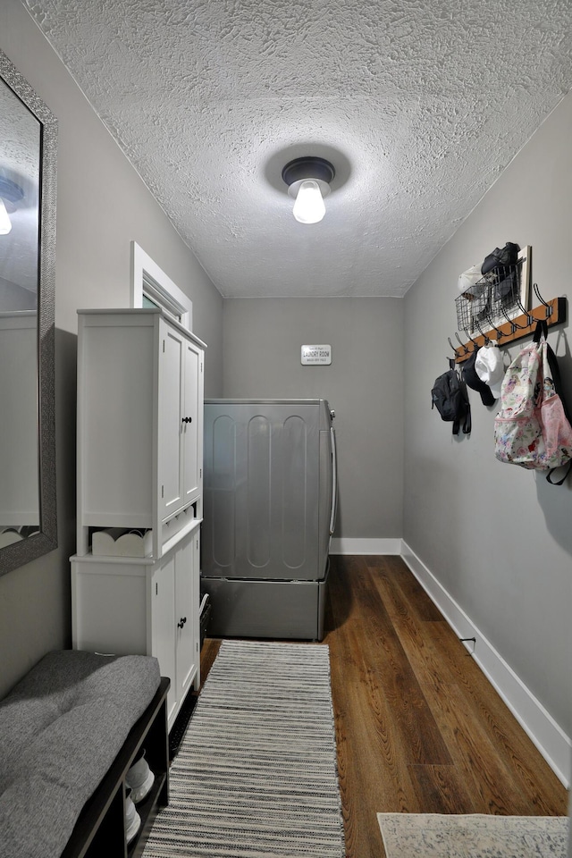 4634 State Route 61, Sunbury, OH 43074 - laundry room with cabinet space, dark wood-style floors, and a textured ceiling