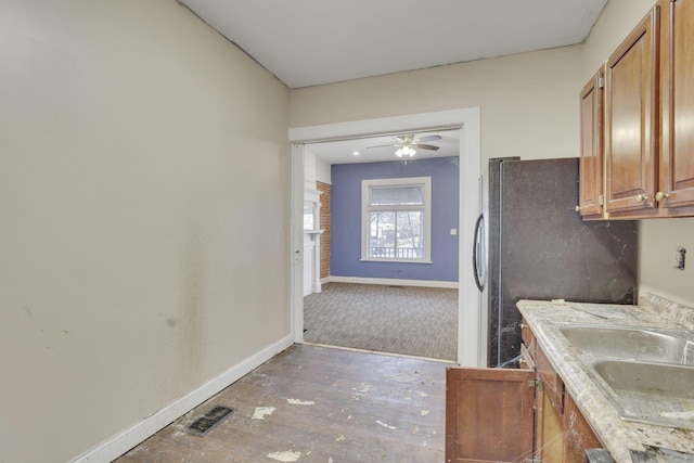 749-751 E Main St Unit 749, Columbus, OH 43205 - kitchen featuring brown cabinets, freestanding refrigerator, light countertops, and light wood-style floors