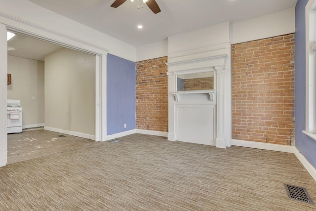 749-751 E Main St Unit 749, Columbus, OH 43205 - unfurnished living room featuring brick wall, a ceiling fan, and recessed lighting