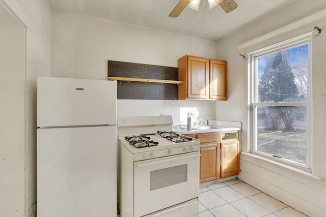 749-751 E Main St Unit 749, Columbus, OH 43205 - kitchen with white appliances, a ceiling fan, light tile patterned floors, light countertops, and plenty of natural light