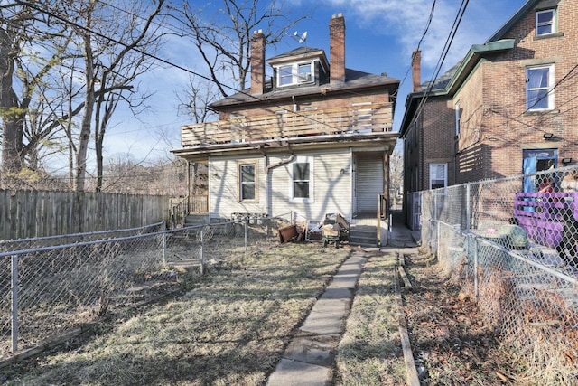 749-751 E Main St Unit 749, Columbus, OH 43205 - back of property with a chimney and a fenced backyard