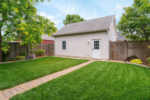 678 S Cassingham Rd, Columbus, OH 43209 - back of property featuring a gate, a fenced backyard, and a shingled roof
