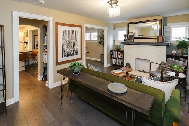678 S Cassingham Rd, Columbus, OH 43209 - living area featuring a brick fireplace and dark wood-type flooring