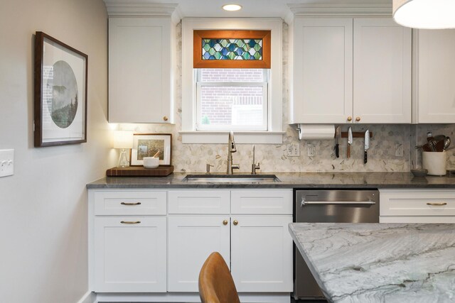 678 S Cassingham Rd, Columbus, OH 43209 - kitchen featuring tasteful backsplash, dark stone countertops, stainless steel dishwasher, white cabinets, and recessed lighting