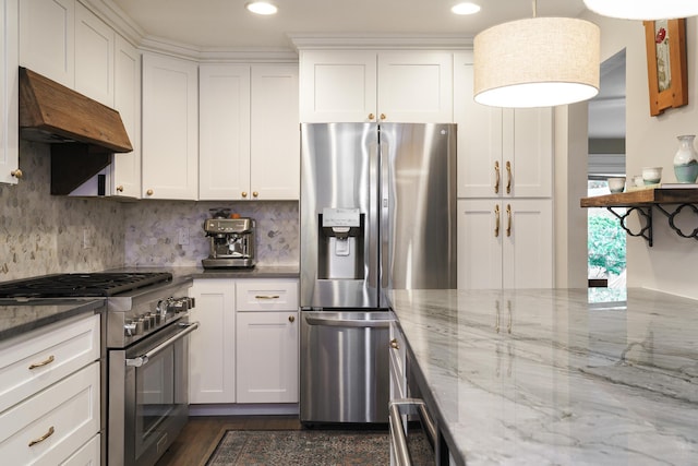 678 S Cassingham Rd, Columbus, OH 43209 - kitchen with stainless steel appliances, premium range hood, white cabinetry, light stone countertops, and tasteful backsplash