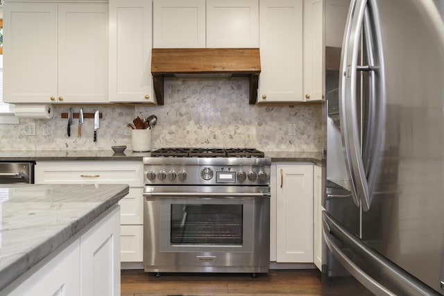 678 S Cassingham Rd, Columbus, OH 43209 - kitchen featuring stainless steel appliances, custom range hood, tasteful backsplash, and white cabinets