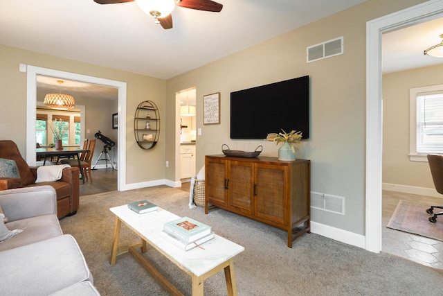678 S Cassingham Rd, Columbus, OH 43209 - living area featuring a ceiling fan, plenty of natural light, and light colored carpet