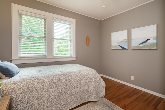 678 S Cassingham Rd, Columbus, OH 43209 - bedroom featuring dark wood-type flooring and ornamental molding