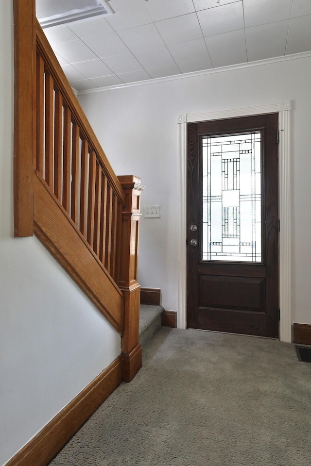 274 E Jenkins Ave, Columbus, OH 43207 - carpeted entryway with stairway and ornamental molding