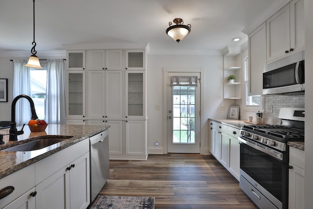 274 E Jenkins Ave, Columbus, OH 43207 - kitchen featuring appliances with stainless steel finishes, open shelves, ornamental molding, white cabinets, and tasteful backsplash