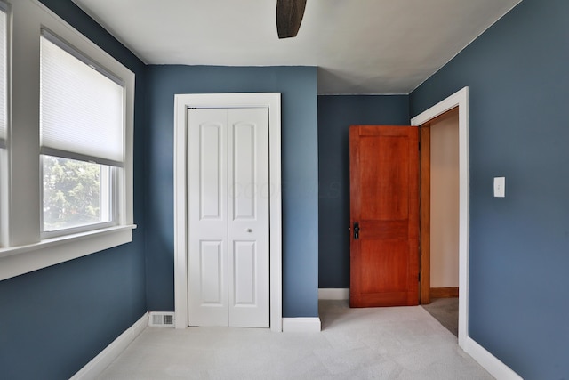 274 E Jenkins Ave, Columbus, OH 43207 - unfurnished bedroom with carpet flooring, a closet, and a ceiling fan