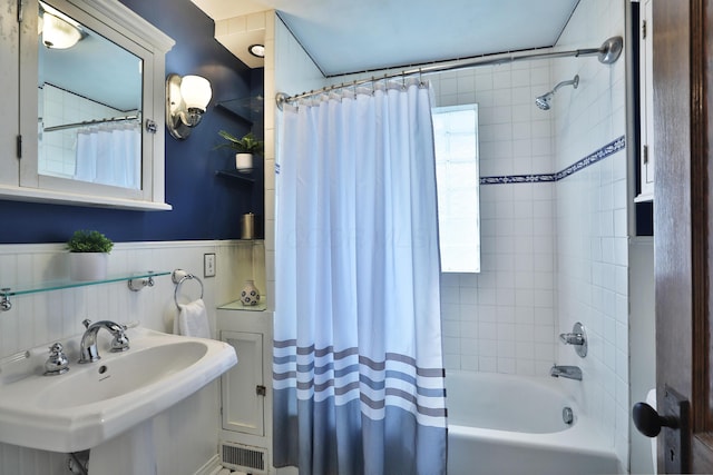 274 E Jenkins Ave, Columbus, OH 43207 - full bathroom featuring shower / bath combo and a wainscoted wall