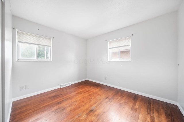 1799 Ormond Ave, Columbus, OH 43224 - unfurnished room featuring plenty of natural light and hardwood / wood-style floors