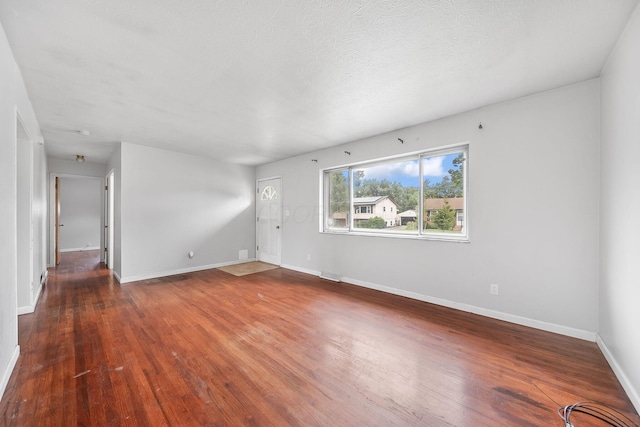 1799 Ormond Ave, Columbus, OH 43224 - unfurnished living room with wood finished floors and baseboards