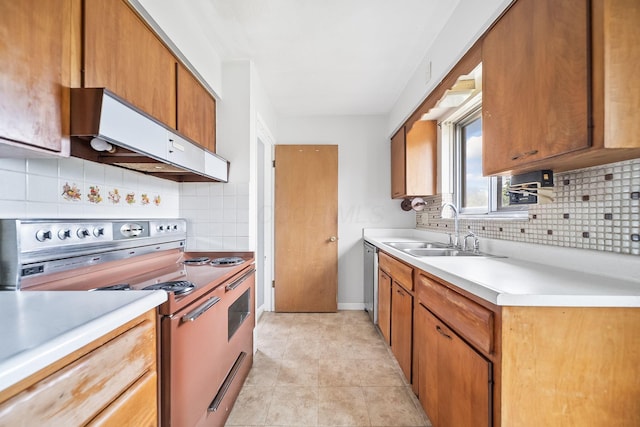 1799 Ormond Ave, Columbus, OH 43224 - kitchen with white electric stove, exhaust hood, tasteful backsplash, light countertops, and brown cabinets
