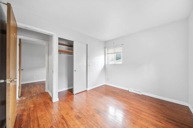 1799 Ormond Ave, Columbus, OH 43224 - unfurnished bedroom featuring wood finished floors and a closet