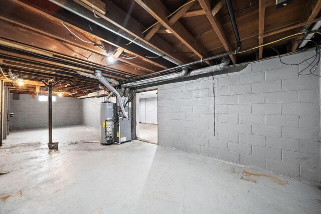 1799 Ormond Ave, Columbus, OH 43224 - unfinished below grade area featuring gas water heater and heating unit